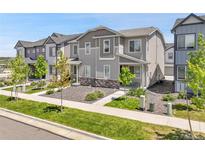 Charming two-story home featuring a modern design, stone accents, and a well-maintained landscaped yard at 12738 Boggs St, Parker, CO 80134