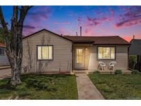 Charming single-story home with a well-maintained lawn and inviting front porch at 2235 W 46Th Ave, Denver, CO 80211