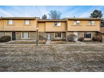 Charming townhouse with a well-maintained lawn and a cozy, inviting facade at 1191 S Troy St, Aurora, CO 80012