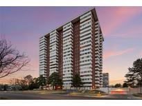 Modern high rise building features an architectural design and multiple windows at 3131 E Alameda Ave # 1203, Denver, CO 80209
