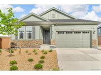 Charming home featuring stone accents, landscaped yard, and a two-car garage in a Gathering-friendly neighborhood at 4418 Soapberry Pl, Castle Rock, CO 80108