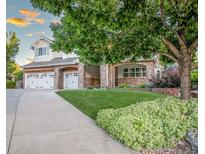 Charming two-story home with three-car garage and meticulously landscaped front yard at 6588 S Sheridan Loop, Littleton, CO 80123
