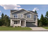 Charming two-story home featuring stone accents, a covered porch, and an attached two-car garage at 2162 S Gold Bug Way, Aurora, CO 80018