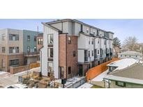 Charming new townhome with brick accents and modern architectural details in a desirable neighborhood at 5423 S Prince St # B, Littleton, CO 80120