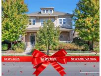 Charming two-story home featuring a well-manicured front yard and inviting entrance at 8537 E 35Th Ave, Denver, CO 80238