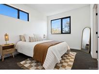 Bright bedroom with natural light, neutral color scheme and stylish decor at 1601 Park Ave # 216, Denver, CO 80218