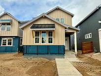 New construction home featuring light brown vertical siding, white trim, and black window awning at 3324 N Catawba Way, Aurora, CO 80019