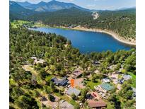 Stunning aerial view of a charming lake community surrounded by lush forestry and mountain views at 4805 S Blue Spruce Rd, Evergreen, CO 80439