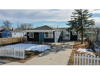 Cute bungalow with new paint, landscaping, and white picket fence at 3282 W 66Th Ave, Denver, CO 80221