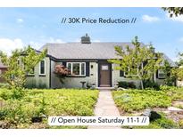 Charming single-story home boasts a landscaped front yard, stone pathway, and inviting front entrance at 1185 Glencoe St, Denver, CO 80220
