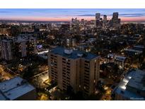 Stunning aerial view of a downtown building with a city skyline at twilight with many building and city lights at 800 N Pearl St # 1203, Denver, CO 80203