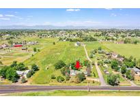 Expansive aerial view of the property, showcasing its idyllic setting with mountain views at 15065 Huron St, Broomfield, CO 80023