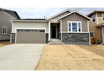 Charming single-Gathering home with a two-car garage and stone accents at 24747 E 40Th Ave, Aurora, CO 80019