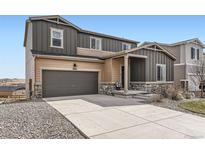 Charming two-story home features a two-car garage and well-manicured lawn at 4807 River Highlands Loop, Elizabeth, CO 80107