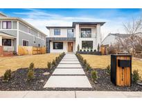 Stunning modern home with walkway, minimalist landscaping and mailbox in a lovely suburban neighborhood at 1518 S Columbine St, Denver, CO 80210