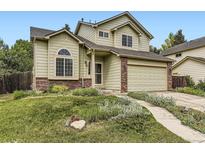 Charming two-story home with a well-maintained lawn and a two-car attached garage at 4267 Ashcroft Ave, Castle Rock, CO 80104