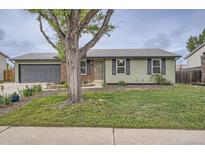Charming single-story home with well-maintained lawn and inviting curb appeal at 5925 W 86Th Ave, Arvada, CO 80003