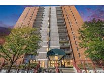 Striking high-rise with brick facade, concrete accents, and multiple balconies at 955 Eudora Street St # 108E, Denver, CO 80220