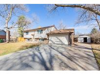 Charming split-level home with a two-car garage and a spacious driveway at 4429 S Field Ct, Littleton, CO 80123