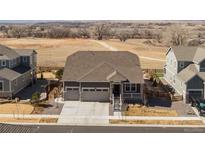 Charming one-story home with a two-car garage and front porch in a beautiful, rural neighborhood at 1931 Marlowe W Cir, Erie, CO 80516