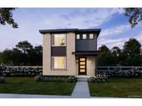Modern two-story home featuring large windows and professional landscaping at 8787 Whiteclover St, Littleton, CO 80125