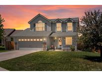 Charming two-story home with a well-manicured lawn and a two-car garage, perfect for families at 2006 E 97Th Ave, Thornton, CO 80229