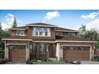 Charming two-story home with a symmetrical design, stone accents, and a welcoming front porch at 3979 Descent St, Castle Rock, CO 80108