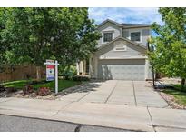 Charming two-story home with a well-maintained front yard and two-car garage at 22379 E Dorado Ave, Aurora, CO 80015