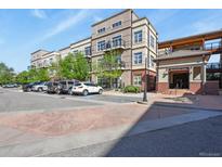 Attractive condo building featuring balconies, well-maintained landscaping, and convenient parking in a desirable location at 5677 S Park Pl # 303, Englewood, CO 80111