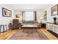 Cozy living room featuring hardwood floors, comfortable seating, and a stylish coffee table at 1400 Bacchus Dr # C11, Lafayette, CO 80026