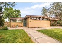 Attractive ranch-style home with unique architecture, manicured lawn, and charming curb appeal at 2849 E Cresthill Ave, Centennial, CO 80121