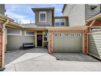 Inviting home exterior with brick accents and a welcoming front door adorned with a wreath at 12831 King St, Broomfield, CO 80020