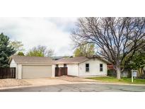 Charming single-story home with an attached garage and well-maintained front yard at 6338 W 92Nd Pl, Westminster, CO 80031