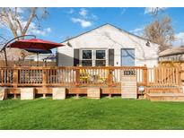 Charming ranch home with a spacious deck and well-maintained lawn at 3825 W 73Rd Ave, Westminster, CO 80030