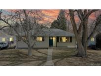 Charming one-story home with mature trees and a cozy front porch perfect for relaxing at 1852 S Forest St, Denver, CO 80222