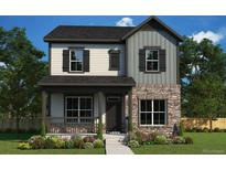 Charming two-story home with stone accents, welcoming front porch and professional landscaping at 21032 E 63Rd Dr, Aurora, CO 80019