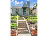 Charming bungalow featuring a beautifully landscaped front yard and inviting front entrance at 1208 S Elizabeth St, Denver, CO 80210