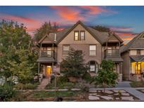 Charming two-story home with a peaked roof and inviting front yard at sunset at 2358 N Ogden St # B, Denver, CO 80205