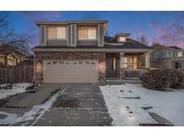 Two-story brick home with attached garage and landscaping at 20572 E Girard Dr, Aurora, CO 80013