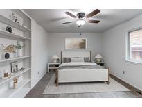 This bedroom boasts a ceiling fan, natural light and nice built-ins on the left side of the shot at 53 S Eagle Cir, Aurora, CO 80012