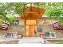 Attractive building exterior with covered entryway and landscaping at 601 Cheyenne St # 202, Golden, CO 80403