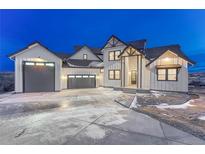 Stunning two-story modern farmhouse-style home with a three-car garage and professionally landscaped front yard at 912 Coronado Dr, Sedalia, CO 80135