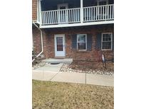 Brick condo building with a private entrance and small landscaping at 7505 W Yale St # 2103, Denver, CO 80227