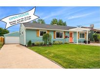 Charming single-story home with a well-manicured lawn, colorful door, and inviting curb appeal at 1892 S Meade St, Denver, CO 80219