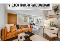 Inviting living room featuring stylish modern decor and open floor plan to the kitchen with light bright countertops at 1349 Race St # 5, Denver, CO 80206