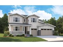 Charming two-story home featuring a welcoming porch and a convenient two-car garage at 5518 Tamarack Ave, Firestone, CO 80504