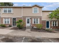 Charming townhome with brick and siding exterior and well-maintained landscaping at 1514 S Ouray Cir # B, Aurora, CO 80017