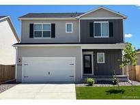Charming two-story home with a two-car garage and well-maintained front lawn at 2224 Alyssa St, Fort Lupton, CO 80621