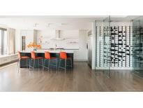 Modern kitchen with marble island, wine storage, and high-end appliances at 1133 14Th St # 2720, Denver, CO 80202