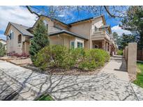 Well maintained home exterior and landscaped yard shows pride of ownership in a quiet neighborhood at 8757 E Dry Creek Rd # 1512, Englewood, CO 80112
